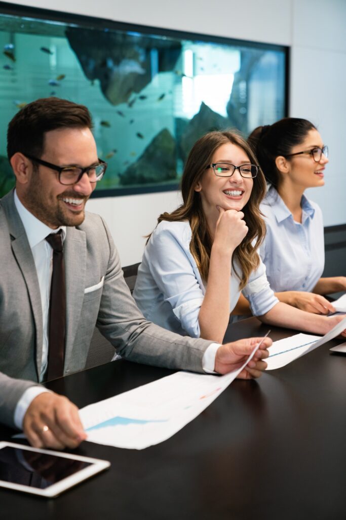 Image of business partners discussing documents and ideas